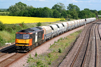 60059 'Swinden Dalesman' in Loadhaul livery at Hathern, MML north of Loughborough on 13.6.09 with 6M34 1109 Crawley - Peak Forest empty cemex hoppers