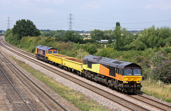 GBRf locos  66746 in old Colas livery tnt 66703 with 2 low JNA wagons at Loughborough on 28.7.11 with 6H67 1239 Etches Park - Peterborough working. The JNA's had been for tyre turning at Derby