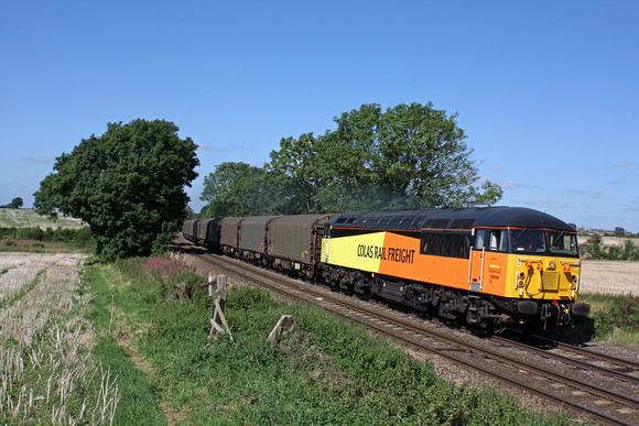56094 at Chellaston heading towards Castle Donington  on 5.9.12 with 6E07 1151 Washwood Heath - Boston Docks empty steel carriers. Note the small numbers on the front of the loco