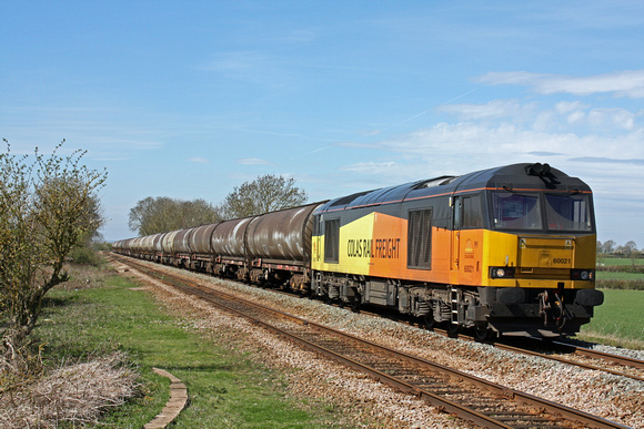 Colas Rail Freight 60021 powers along the straight at Muston near Bottesford on 14.4.15 with 6E82 1216 Rectory Jn (Colwick ) - Lindsey Oil Refinery Colas empty bogie tanks