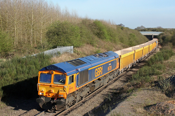GBRf 66729 'Derby County' is seen climbing Bagworth Incline on the, Leicester - Coalville line, on 14.4.15 with 6M40 1156 Westbury Up T.C. - Cliffe Hill Stud Farm empty yellow IOA wagons