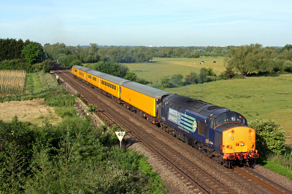 DRS 37604 in beautiful early sunlight is seen from Syston bypass roadbridge heading towards Melton Mowbray on 15.6.15 with 3Z10 0636 Derby R.T.C.(Network Rail) - Old Dalby test train