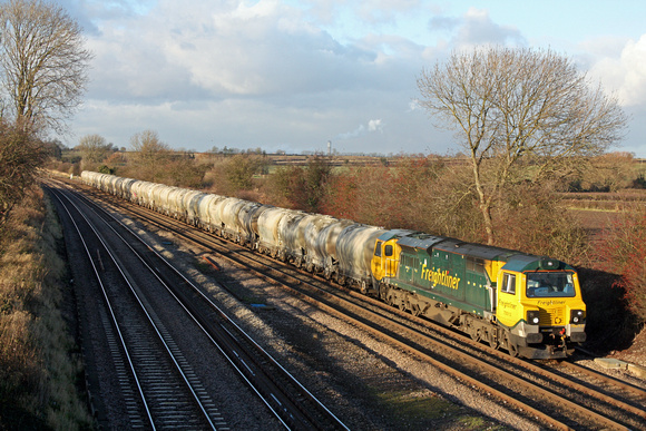 70013 at Normanton on Soar, MML  heading towards Loughborough on 3.12.12 with 6L87 1237 Earls Sdgs - West Thurrock loaded small PCA  cement tanks in lovely winter colours