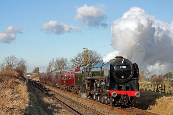 BR Standard Class  7 No 70013 'Oliver Cromwell' powers along the Quorn Straight on 30.1.10 with 1345 Loughborough - Leicester North service at the GCR Winter Steam Gala January 2010