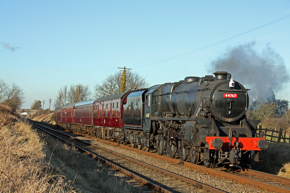 LMS Black 5 No 44767'George Stephenson'on 30.1.10 powers along the Quorn Straight on 30.1.10 with 1430 Loughborough - Leicester North service at the GCR Winter Steam Gala January 2010