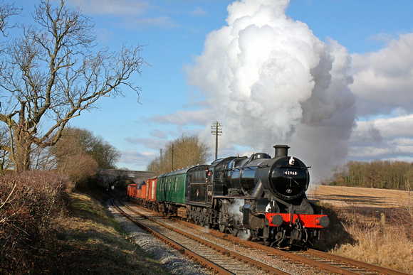 LMS Stanier Mogul No. 42968 at Rabbit Bridge near Swithland on 31.1.10 with 1245 Loughborough - Rothley Brook mixed freight at the GCR Winter Steam Gala January 2010