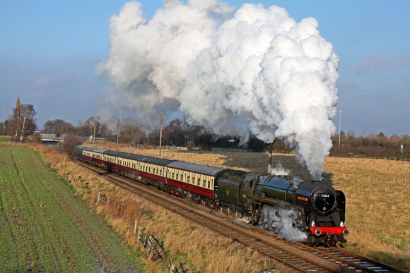British Railways  Class 7 No 70013 'Oliver Cromwell' at Woodthorpe on 25.12.2009 with 1300 Loughborough - Leicester North Christmas Day luncheon service under a lovely blue sky