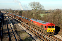66152 in DB Schenker livery is seen at Normanton On Soar north of Loughborough on 21.1.11 with 6M96 0550 Margam - Corby loaded steel coil with Ratcliffe P.S. in the background
