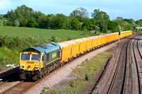 66620 heads north along the slowline of the MML at Hathern on 19.5.09 with 6U83 1645 Mountsorrel - Doncaster Virtual Quarry loaded yellow IOA wagons