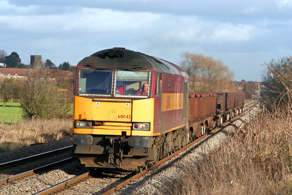 60042 in EWS red and gold livery at Narborough heading towards Nuneaton TV on 29.11.07 with a short  6V92 1010 C orby BSC - Margam empty steel coil wagons