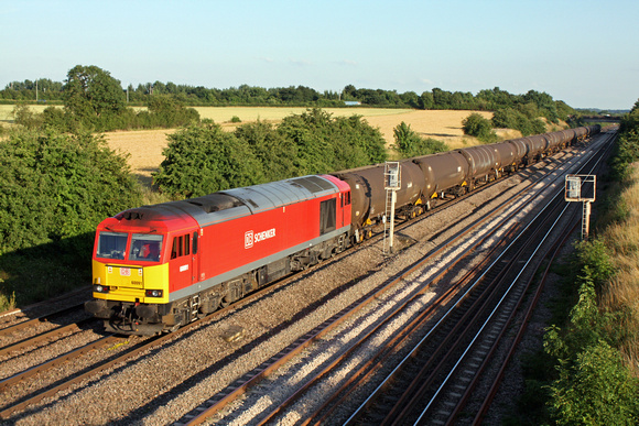 DB Schenker red livery 60091 at Cossington, MML heading towards Sileby Junction on 6.8.13 with 6E38 1354 Colnbrook Elf Oil Siding -  Lindsey Oil Refinery empty bogie tanks in late evening sunlight