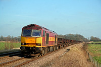 EWS livery 60083 at Rearsby heading towards Syston East Junction on 08.02.08 with 6V92 1010 Corby BSC - Margam empty steel coil wagons