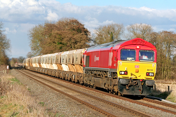 DB Schenker livery 66152 at East Goscote heading towards Syston East Junction on 4.3.09 with  6M45 1417 Barham - Mountsorrel empty 4 wheel stone hoppers