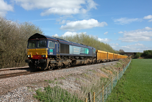 DRS 66428 at Barrow Upon Trent heading towards Stenson Junction on 9.4.14 with 6U77 1342 Mountsorrel Sdgs to Crewe Bas Hall S.S.N. loaded IOA Network Rail yellow wagons