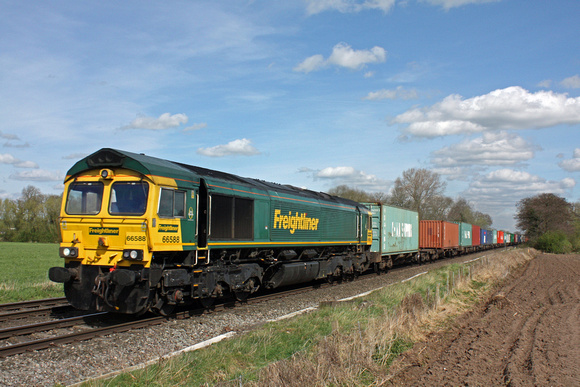 Freightliner 66588 passes East Goscote near Syston East Junction on 3.4.17 with 4M81 0801 Felixstowe North F.L.T. - Crewe Bas Hall S.S.N. well loaded Intermodal