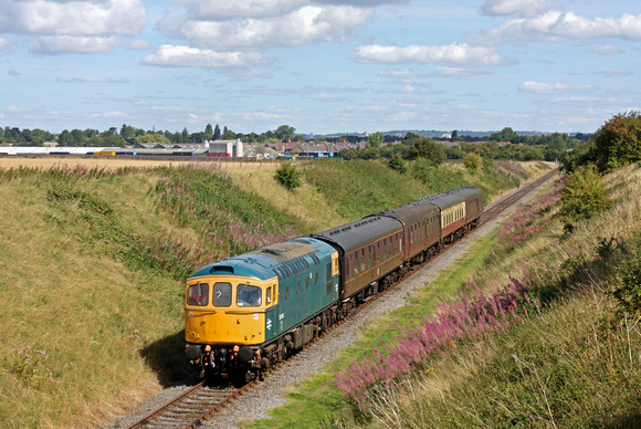 Due to the failure of the GCRN steam loco, diesel Class 33 No 33035 was substituted and on 13.8.17 is seen approaching Asher Lane bridge, Ruddington with 1100 Ruddington - Loughborough service