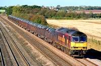 60053 in EWS red and gold livery at Cossington, MML on 19.10.07 with 6M96 0550 Margam - Corby BSC loaded steel coil wagons