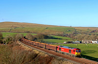 DB Cargo 60054 in red Schenker livery rounds the curve at Smardale on S & C line on 15.11.18 with 6E97 1044 New Biggin British Gypsum to Tees Dock Bsc Export Berth empty MBA gypsum wagons