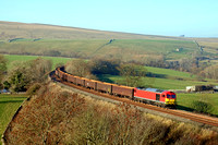 DB Cargo 60010 with no branding passes Smardale on S & C Line on 17.11.18 with 6E95 1044 New Biggin British Gypsum to Milford West Sidings empty MBA Gypsum wagons