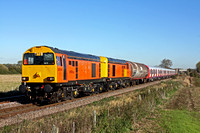 20314 & 20311 in HN Rail orange livery lead LU 'S' Stock with 20118 & 20096 at rear at Copleys Brook on the outskirts of Melton Mowbray on 4.11.13 with 7X09 1142 Old Dalby - West Ruislip LUL Dept move