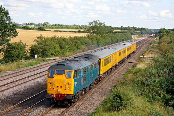 31106 in BR Blue  races north at Cossington, MML on 31.7.10 with 1Z14 0944 Dollands Moor - Derby RTC test train