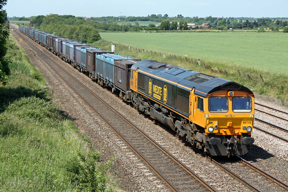 66709 wth Medite branding at Cossington, MML heading towards Leicester on 28.6.10 with 4M82 1150 Doncaster Down Decoy - Hotchley Hill loaded Gypsum containers running via Humberstone Road, Leicester