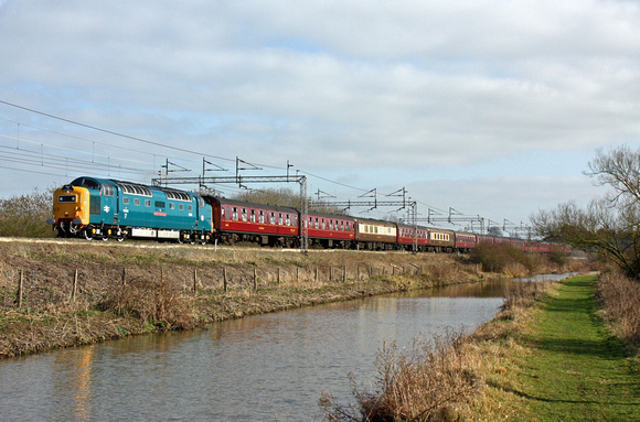 Deltic 55022 tnt 57601 alongside the Oxford Canal at Ansty heading towards Nuneaton on 6.3.11 with 1Z28 1306 London Euston - Preston Spitfire Tours positioning Railtour