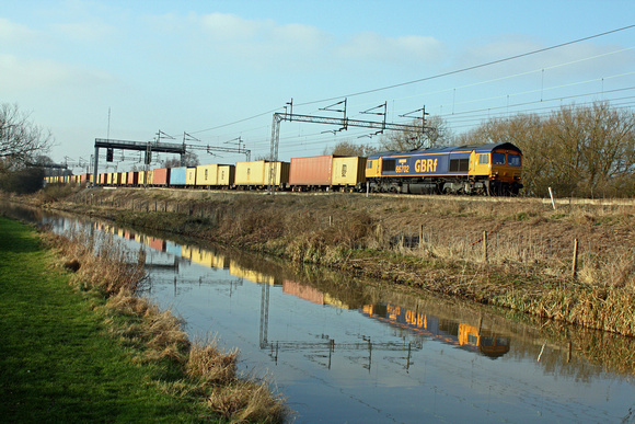 66702 alongside the Oxford Canal at Ansty heading towards Rugby on 2.3.11 with 4L22 1521 Hams Hall - Felixstowe Intermodal