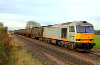 60099 in tata livery  at Elsham Carrs near Scunthorpe on 23.11.11 heading towards Barnetby with  6D42 1142 Eggborough Power Station - Lindsey Oil Refinery empty bogie tanks