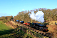 LMS 8F 48305 passes Kinchley Lane on 26.1.24 with 1330 Loughborough to Rothley Brook demo tank train at the  GCR Winter Steam Gala 2024