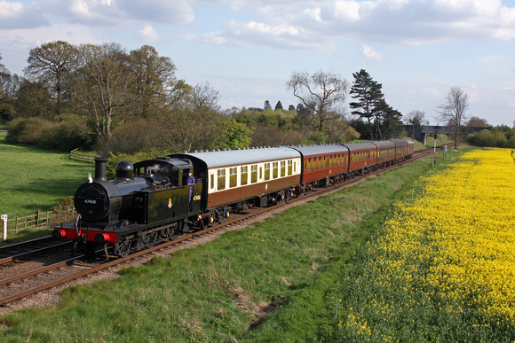 LMS 3F Jinty 47406  at Woodthorpe, GCR on 6.5.12 with 1600  Leicester North - Loughborough alongside a delightful oilseed rape field