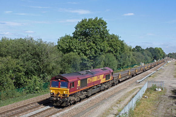 DB Cargo 66221 accelerates past Stenson Junction having just joined the mainline from the Castle Donington branch on 1.9.16 with 6X01 1017 Scunthorpe Trent T.C. - Eastleigh East Yard welded long rail