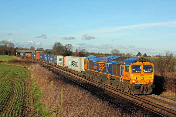 GBRf 66731 passes Thurmaston, MML heading towards Leicester on 3.2.16 with 4M38 1029 Felixstowe North Gbrf - Birch Coppice well loaded liner in low afternoon sun