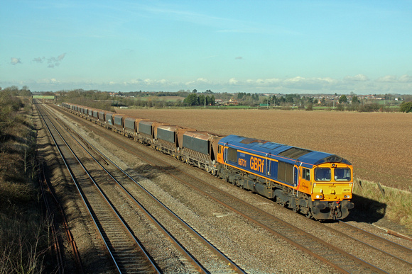 GBRf 66731 'Interhub GB' ambles along the MML at Cossington heading towards Syston East Junction on 11.2.16 with 6M01 1051 Tinsley Yard - Croft Quarry empty hoppers