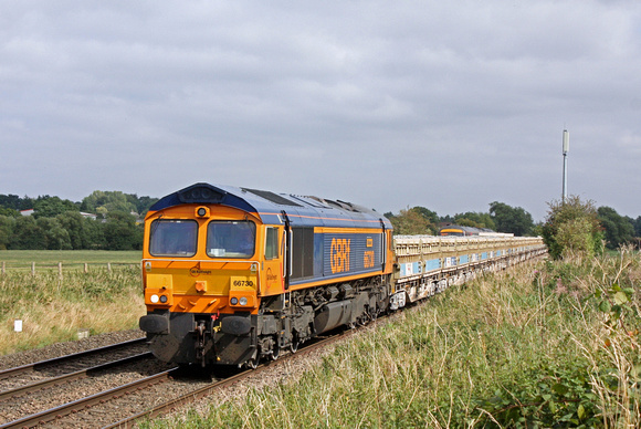 GBRf 66730 'Whitemoor' is seen at Narborough on 7.9.16 with 6G16 1123 Cliffe Hill Stud Farm - Bescot Up Engineers Sdgs loaded MRA Side Tippers. The top of  a Class 170 heads into Leicester seen above