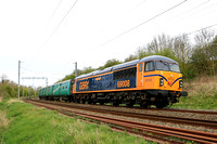 Class 69 No 69008 'Richard Howe' drags 2 Arlington Fleet Translator Vehicles 64707 and 64664  'Labezerin & Liwet' past Braybrook Road, Market Harborough on 8.4.24 with 5O26 1013 Leicester L.I.P. to Ea