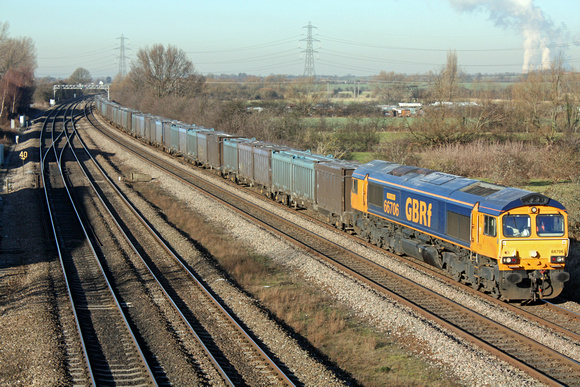 66706'Nene Valley' at Loughborough on 20.1.11 with 4M82 1015 Cottam Power Station - Hotchley Hill (East Leake) loaded gypsum containers. Ratcliffe P.S. is working flat out seen on the skyline