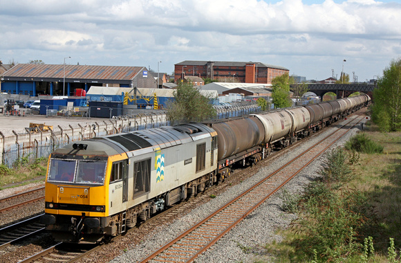 60054 'Charles Babbage' in EWS two tone grey livery at Burton upon Trent on 26.4.10 with 6M57 0717 Lindsey Oil Refinery -  Kingsbury Oil Sdgs loaded bogie tanks
