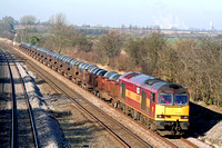 60048 'Eastern' inn standard EWS red and gold livery at Normanton on Soar heading towards Loughborough on 13.2.08 with 6M96 0548 Margam - Corby BSC loaded steel coil wagons