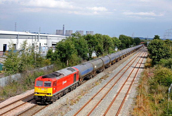 60054 in DB Schenker livery is seen at Castle Donington heading towards Stenson Junction on 22.8.14 with 6M00  1140 Humber Oil Refinery - Kingsbury Oil Sdgs  loaded blue bogie tanks