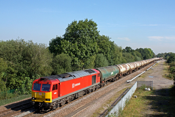 DB Cargo 60092 in DB Schenker livery breezes past Stenson Junction on a sunny 13.9.16 with 6M57 0715 Lindsey Oil Refinery - Kingsbury Oil Sdgs loaded bogie oil tanks
