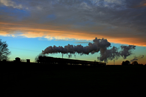 Red 8F No 48624 silhouetted against a magnificent colourful skyline at Quorn on 23.11.14 with late running 1530 Loughborough - Leicester North service at the last Hurrah of the Season 'Steam Gala'