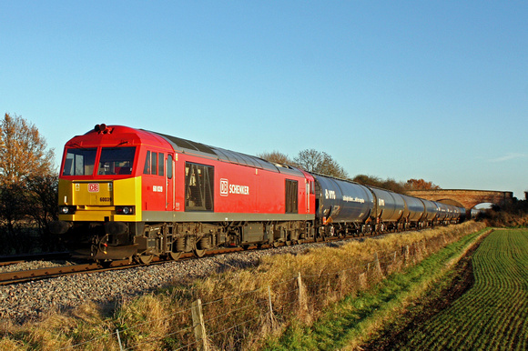 DB Schenker livery 60039 at Barrow Upon Trent heading towards Stenson Junction on 4.12.13 with 6M00 1140 Humber Oil Refinery - Kingsbury Oil Sidings loaded blue bogie tanks in the low sun