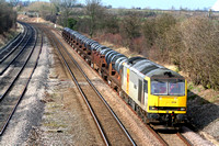 60034 in two tone grey EWS livery at Normanton on Soar heading towards Loughborough on 5.3.08 with 6M96 0550 Margam - Corby BSC loaded steel coil wagons