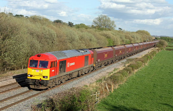 60039 in DB Schenker livery, fresh from a B Exam at Toton TMD, is seen at Barrow Upon Trent near Stenson Junction on 8.4.14 with 6F58 1628 Toton Up Yard - Liverpool Bulk Terminal empty coal hoppers