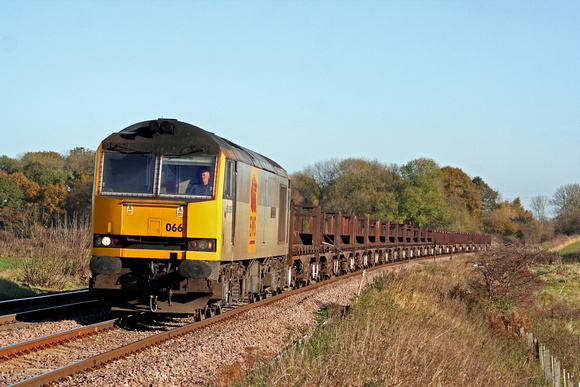 60066 in EWS two tone grey livery at Rearsby heading towards Syston East Junction on 9.11.07 with 6V92 1010 Corby BSC - Margam empty steel coil wagons in beautiful light and colours
