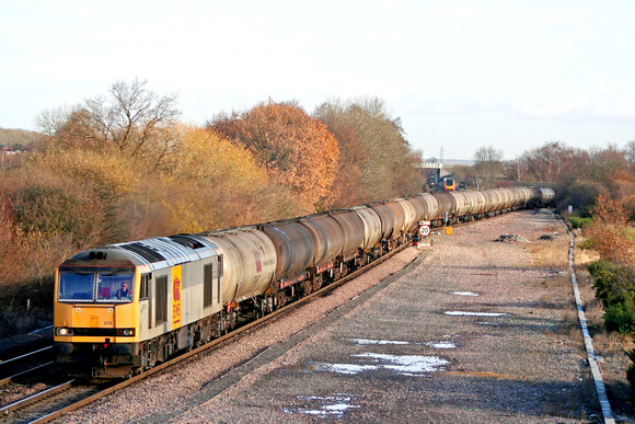 60074 in two tone grey EWS livery Stenson Junction on 3.12.07 with 0715 Lindsey Oil Refinery - Kingsbury Oil Sidings loaded bogie tanks