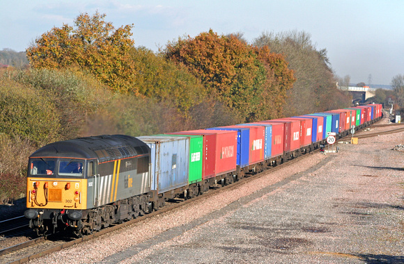 Fastline 56302 dashes through Stenson Junction on 15.11.07 with 4O90 1051 Doncaster - Thamesport container train in lovely autumn colours
