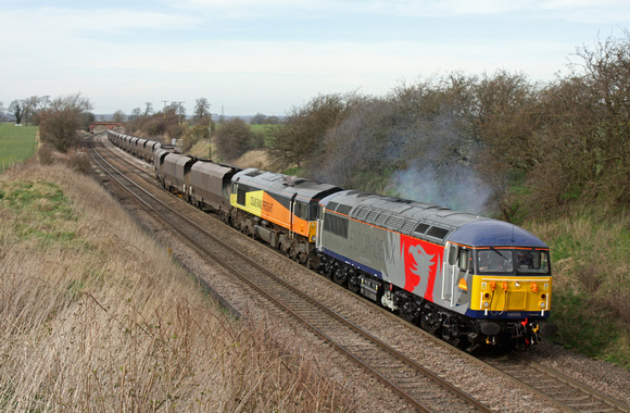 Europhoenix 56096 with dead 66848 departs Elford loop 19.3.14 with 4V30 0825 Ratcliffe  Pst - Avonmouth  empty coal hoppers. The 56 had rescued the train and terminated the working at Landor St Jn