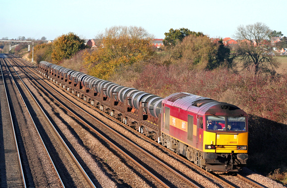 60035 is bathed in Autumn colours at Cossington, MML heading towards Syston East Junction on 12.11.07 with 6M96 0548 Margam - Corby BSC loaded steel coil wagons